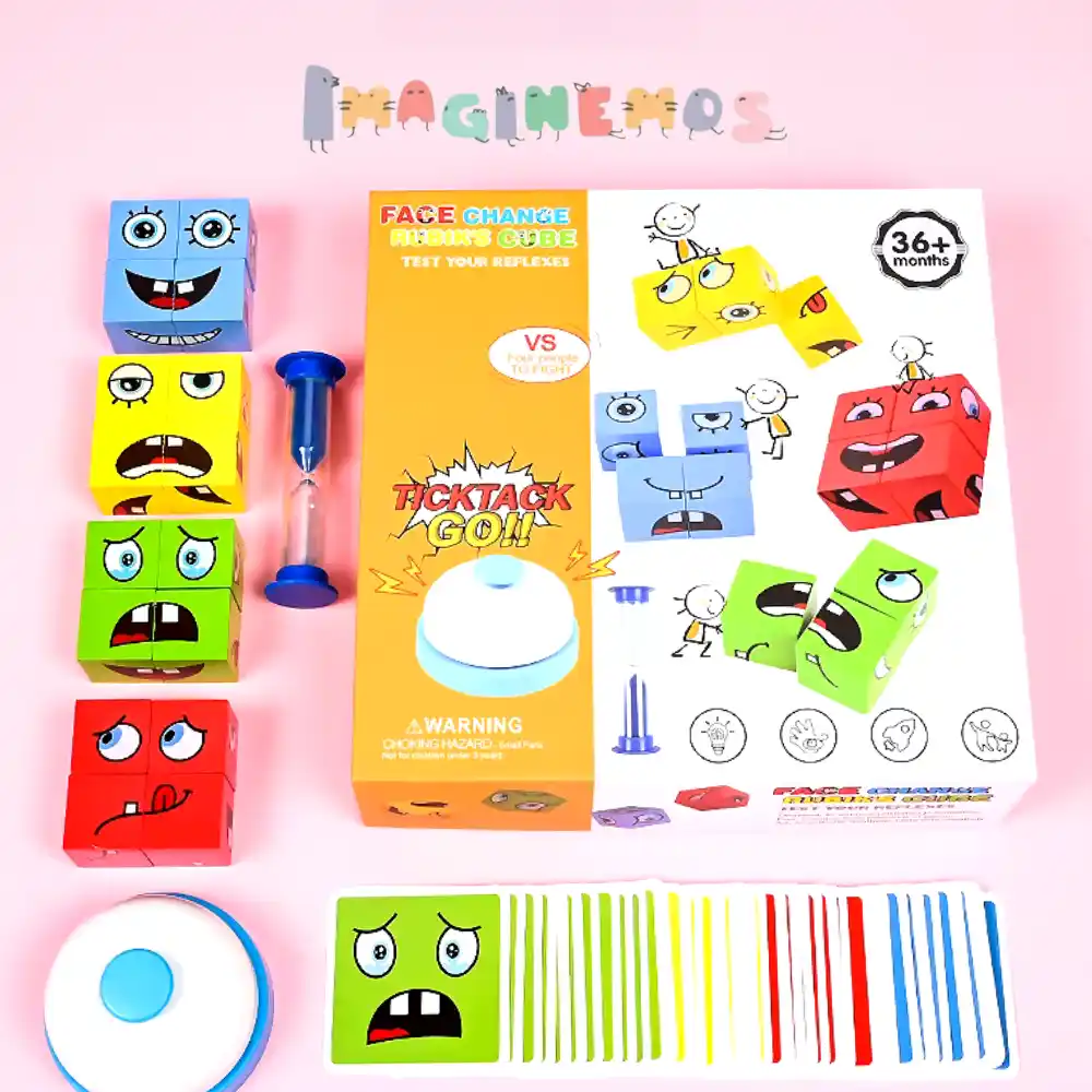 Juego educativo con cubos de caritas expresivas, cartas de colores, reloj de arena y timbre de desafío para trabajar emociones y rapidez mental en niños.